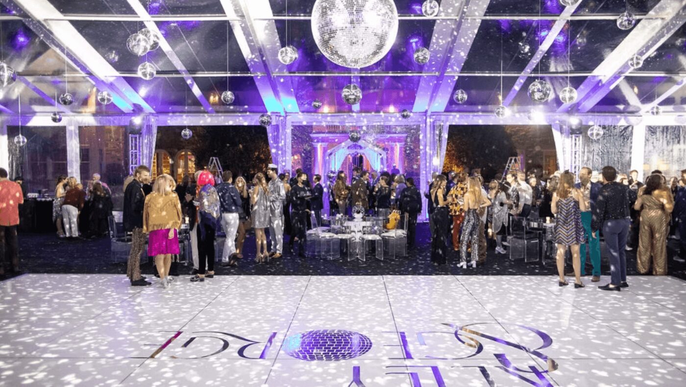 Ballroom gala with crystal chandeliers and lavender lighting